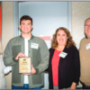 Connor Wetmore (second from the left), accepts his award with his parents by his side and Kimberly Ellertson, Woodinville Chamber Executive Director